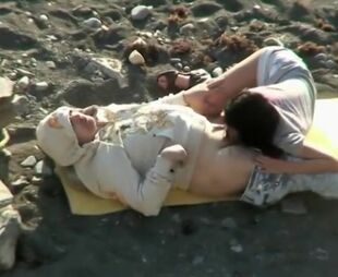 couple having sex on beach